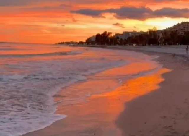 Sunset walks by the sea