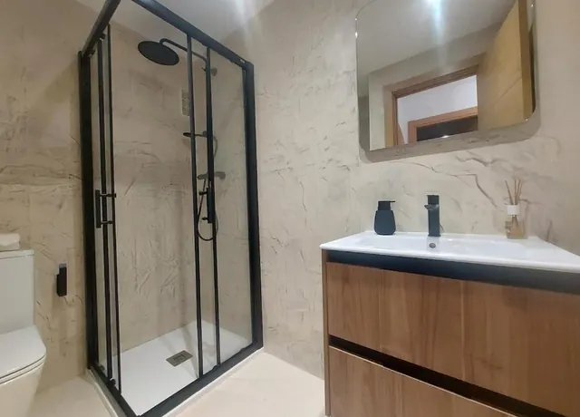 Shower and vanity with modern finishes